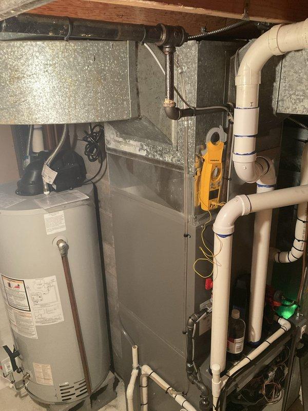 Completed scheduled club membership maintenance visit for residential HVAC system. Performed comprehensive inspection of air handler unit including blower motor assembly, electrical connections, and internal components. Noted rust staining on interior metal surfaces indicating previous moisture exposure. Inspected mechanical room housing furnace/air handler, water heater, and associated plumbing infrastructure. All electrical connections and wiring verified secure, including motor leads and control wiring. System operational at time of service completion.