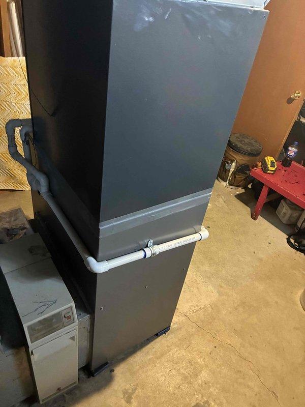 Completed installation of 70,000 BTU furnace system including all mechanical and electrical connections. Successfully connected PVC venting, gas line with shut-off valve, and integrated unit with existing ductwork in utility room. All components tested and system operational upon completion.