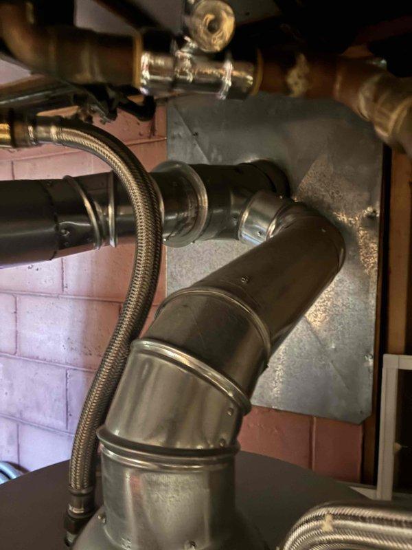 Completed installation of 70,000 BTU furnace system including all mechanical and electrical connections. Successfully connected PVC venting, gas line with shut-off valve, and integrated unit with existing ductwork in utility room. All components tested and system operational upon completion.