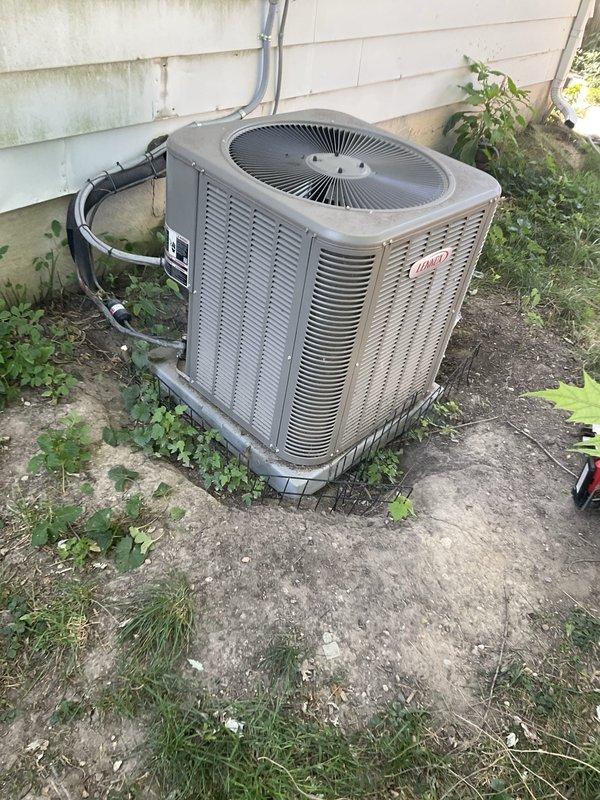 Responded to no-cooling complaint on 2-year-old Lennox AC system. Upon arrival, confirmed unit would not power on. Inspected low-voltage thermostat wiring and discovered damaged control wire between indoor air handler and outdoor condensing unit—wire insulation chewed through by rodents, causing open circuit. Repaired damaged section of thermostat wire, restored proper connections, and verified 24VAC signal at contactor. Tested system operation; unit powered on successfully with compressor and condenser fan running normally. Confirmed proper cooling cycle and advised customer on potential pest prevention measures to protect wiring.