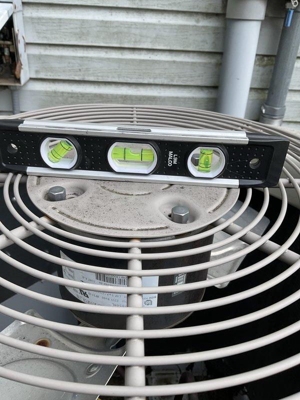 Responded to no-cool complaint where AC unit was running constantly but struggling to maintain temperature throughout the home. Upon arrival, performed comprehensive system evaluation and found outdoor condenser unit significantly out of level, which can cause compressor oil migration issues and reduced cooling efficiency. Used precision level to verify unit was not properly positioned on pad, then releveled condenser unit to manufacturer specifications to ensure proper refrigerant flow and compressor lubrication. Verified unit operation after leveling correction.