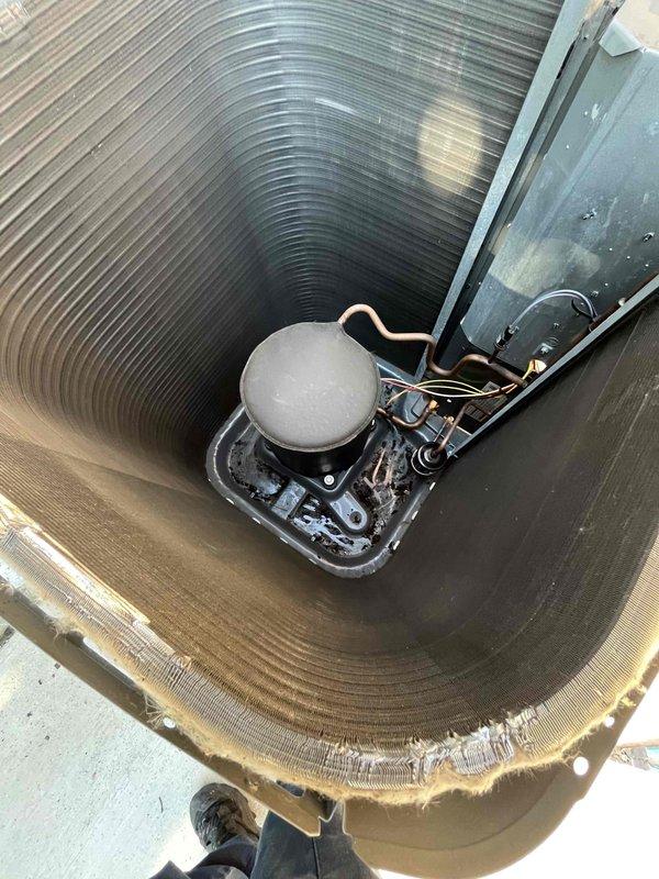 Completed prepaid air conditioning tune-up and maintenance inspection on rooftop-mounted condensing unit. Performed comprehensive system evaluation including electrical connections, refrigerant line inspection, condenser coil cleaning, and internal component assessment. All mechanical and electrical components found operating within normal parameters with no deficiencies noted.