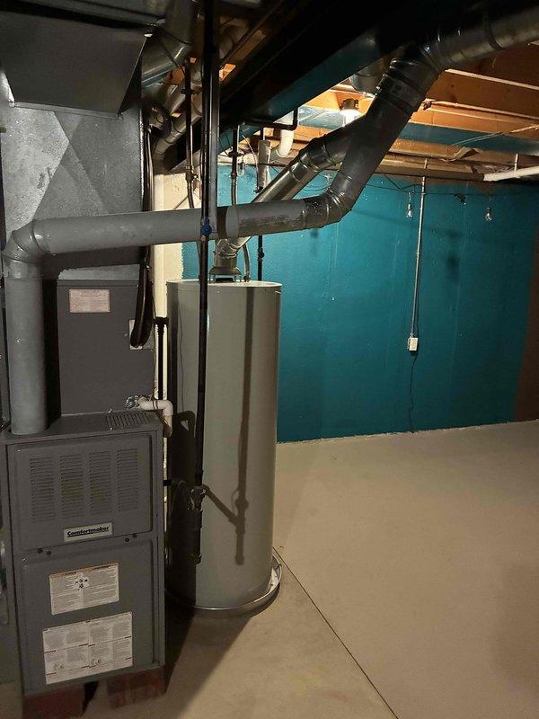 Conducted comprehensive HVAC system evaluation on aging R22 residential system with multiple component failures. Diagnosed failing condenser fan motor and blower capacitor reading out of acceptable range, both requiring immediate replacement. Due to obsolete R22 refrigerant and age of existing equipment, provided detailed estimate for both individual component repairs and complete system replacement options. Documented current system configuration including furnace, ductwork, and mechanical room layout with photographic evidence for customer reference and proposal development.