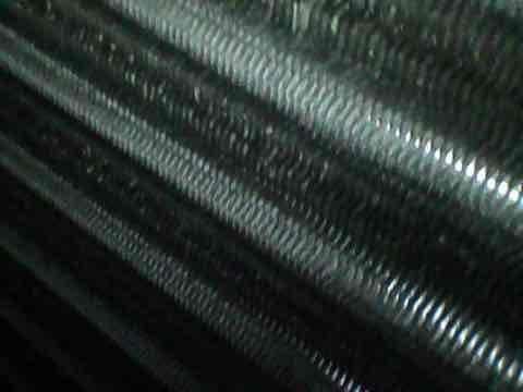 Responded to service call for water pooling under 4-year-old AC condenser unit following heavy rain. Upon inspection, found condenser unit unlevel, causing improper drainage from the condensate system. Verified condenser coils were clean and system was maintaining proper cooling operation with no refrigerant issues. Leveled outdoor condenser unit using adjustable pad, ensuring proper pitch for water drainage away from unit. Confirmed unit stability and tested system operation. System now draining properly with no water accumulation at base.