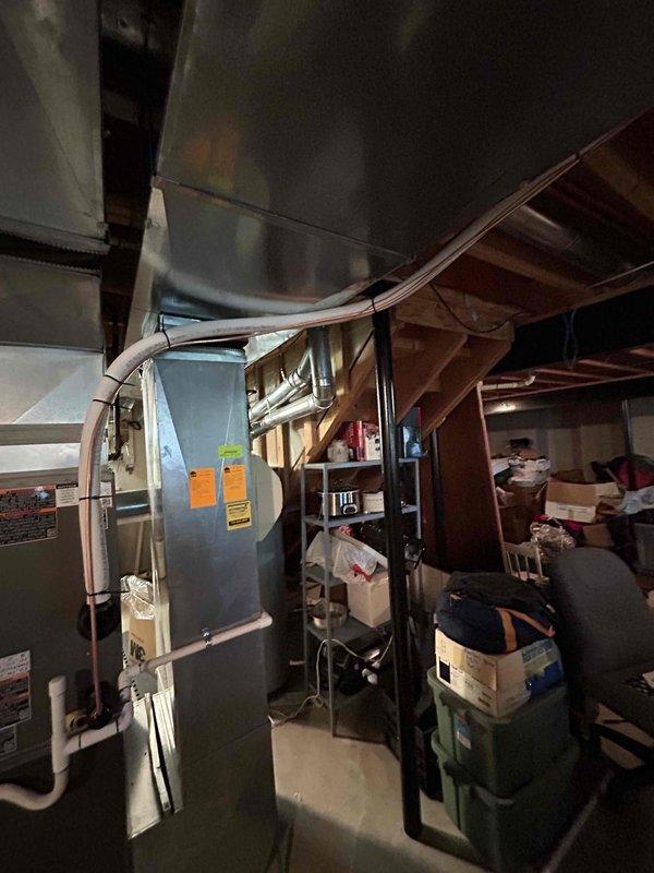 Successfully installed a new 3-ton Daikin air conditioning system with matching evaporator coil in the basement utility area. The installation included proper refrigerant line connections, electrical hookup, condensate drainage via PVC piping, and reconnection of all ductwork to the existing air handler. All mechanical and electrical components were installed to manufacturer specifications and tested for proper operation.