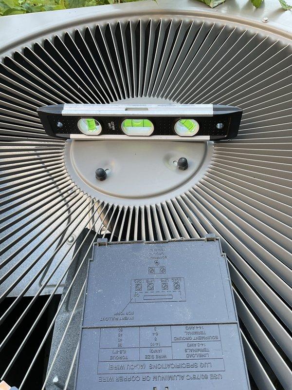 Responded to no cool call and diagnosed system with water discharge issue from evaporator coil. Performed diagnostic evaluation with repair service, which included leveling the outdoor condensing unit to ensure proper drainage and system operation. Verified unit was properly positioned using precision leveling tools and confirmed equipment was secured and functioning correctly upon completion.