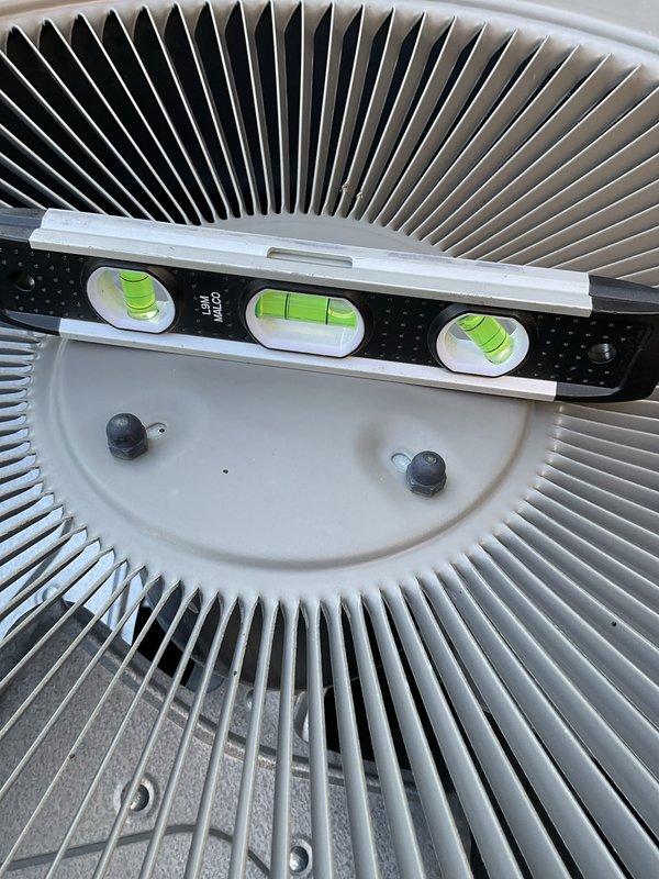 Responded to no cool call and diagnosed system with water discharge issue from evaporator coil. Performed diagnostic evaluation with repair service, which included leveling the outdoor condensing unit to ensure proper drainage and system operation. Verified unit was properly positioned using precision leveling tools and confirmed equipment was secured and functioning correctly upon completion.