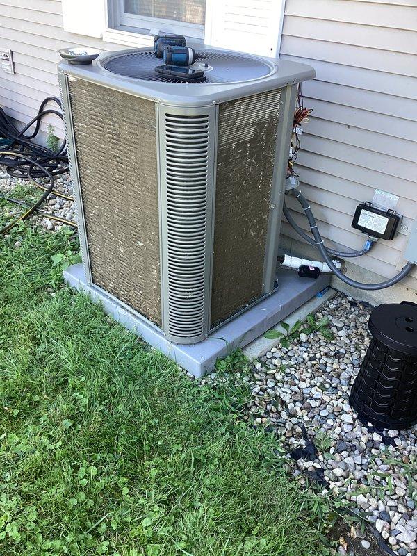Completed preventive maintenance agreement visit on residential AC system under Club AC8-12 plan. Performed comprehensive inspection of outdoor condenser unit, including visual assessment of cabinet condition, refrigerant line connections, and electrical components. Unit showed normal age-related weathering but remained operational. Documented equipment condition with photographs for service records.