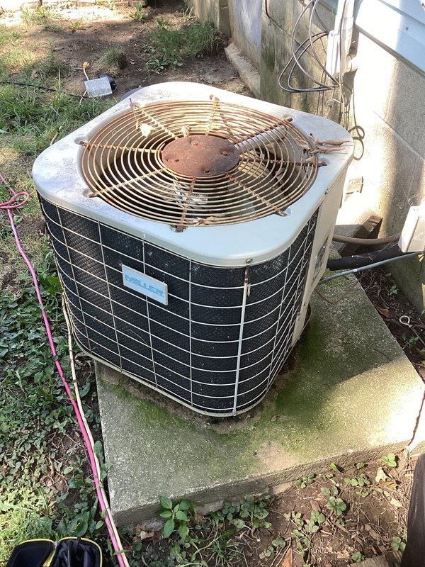 Responded to Club AC service call for air conditioning unit not cooling. Upon arrival, performed comprehensive system inspection and found aged outdoor condenser unit with significant weathering and corroded disconnect box with extensive rust damage. Completed standard maintenance protocol including system diagnostics, verified electrical connections despite corroded disconnect housing, and assessed overall equipment condition. Unit operational following service visit.
