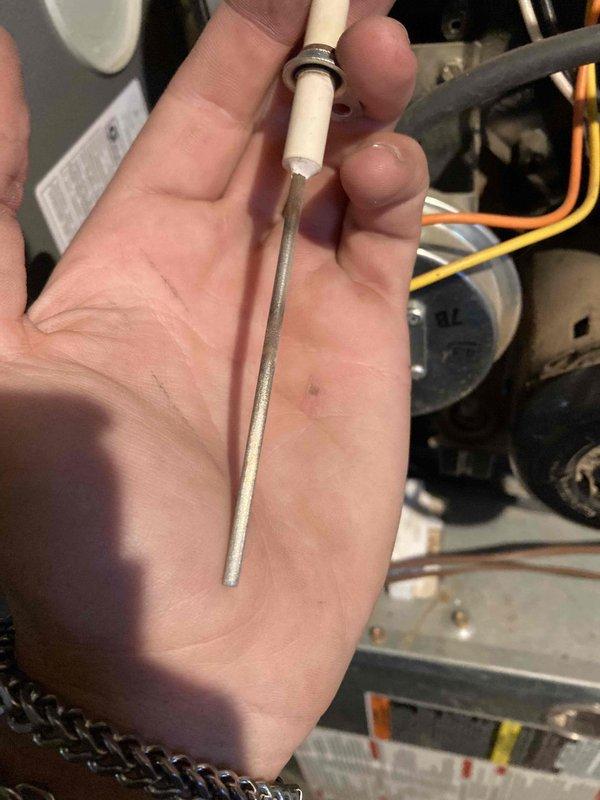Completed preventive maintenance tune-up on heating system. Performed system diagnostics using clamp meter to verify electrical readings and amperage draw. Inspected and cleaned flame sensor rod, which showed carbon buildup and discoloration from normal operation, to ensure proper flame detection and system safety during heating cycles.