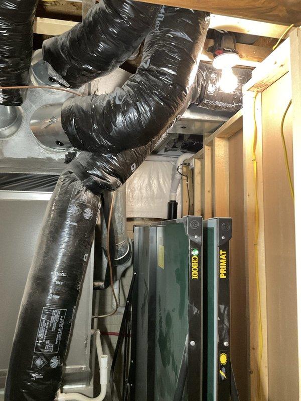 Completed comprehensive AC tune-up on dual air handler system in residential mechanical space. Inspected condensate drainage configuration and discussed options with homeowner for rerouting the condensation line to improve drainage efficiency and prevent potential water damage. All HVAC components, ductwork connections, and electrical connections verified to be functioning properly with no immediate service concerns identified.