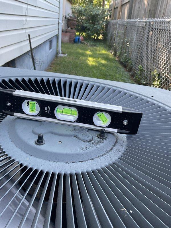 Completed scheduled cooling maintenance tune-up on residential AC system. Performed air filter replacement and comprehensive outdoor condenser unit maintenance. Verified unit levelness using precision level tool, inspected and cleaned condenser coils, checked refrigerant levels, and secured all ductwork connections with proper sealing at junction points. System tested and confirmed operating properly with no issues found.