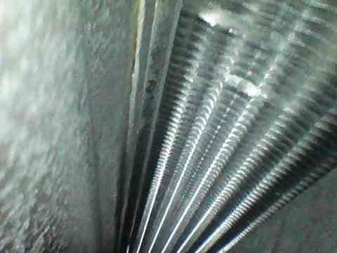 Completed routine AC tune-up and preventative maintenance on newly installed air conditioning system. Performed comprehensive inspection of evaporator coil assembly, verified proper fin condition and cleanliness, and inspected return air grille for adequate airflow. System operating within normal parameters with no issues identified during first scheduled maintenance visit.