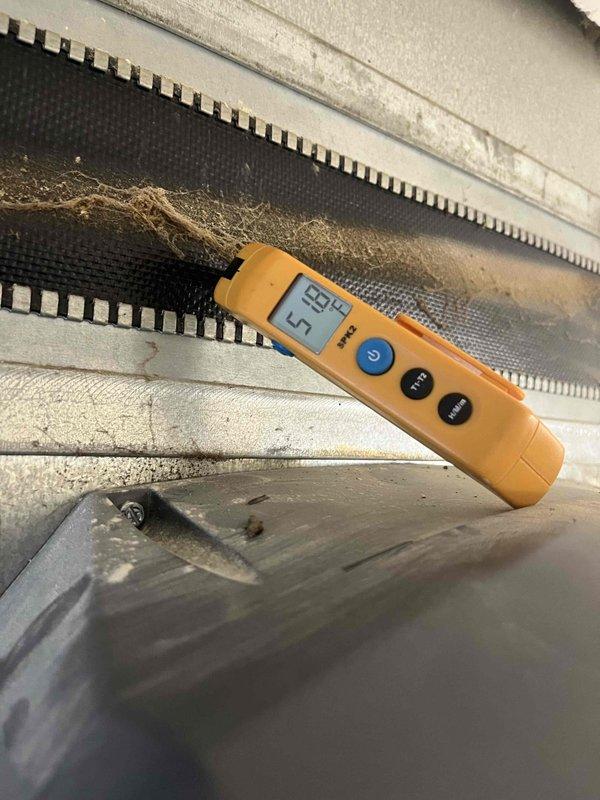 Completed preventative maintenance agreement visit for air conditioning system. Temperature readings were recorded at evaporator coil showing 55°F supply air and 35°F coil surface temperature, indicating proper refrigerant charge and system operation. Inspected indoor air handler unit and documented moderate dust and debris accumulation on evaporator coil fins and filter screen, which is typical for routine maintenance intervals. All system components were accessible and operational at time of inspection.