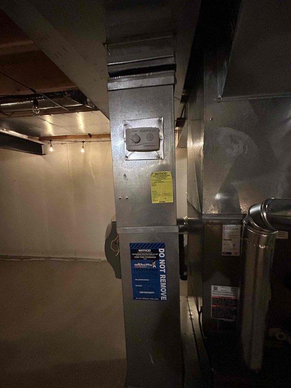 Completed full HVAC system installation including furnace, air conditioning unit, and humidifier with all mechanical and electrical connections. Installed new air handler unit in basement utility area with proper ductwork integration and secured all mounting hardware. Connected refrigerant lines to outdoor condensing unit and charged system to manufacturer specifications, verifying proper refrigerant pressures using calibrated diagnostic gauges. Performed electrical reconnection for all components ensuring code-compliant wiring and proper voltage supply. Integrated whole-home humidifier into duct system for climate control. Tested all equipment for proper operation, confirmed airflow, and verified system cycling. System commissioned and operational upon completion.
