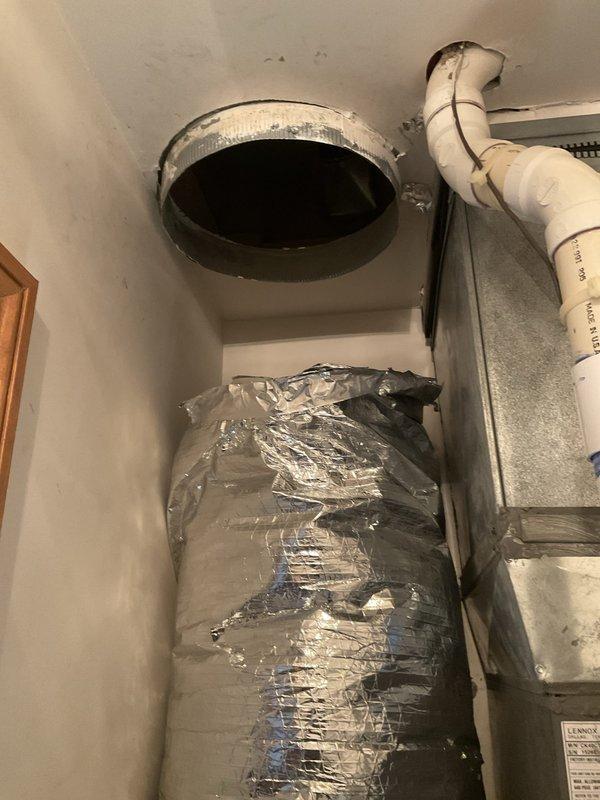 Responded to installation callback for reported ductwork separation above evaporator coil. Upon inspection, found flexible supply duct had disconnected from plenum collar at ceiling penetration. Reconnected and secured flexible ductwork to metal collar using proper strapping, ensuring airtight seal and adequate support to prevent future separation. Verified all mechanical and electrical connections, confirmed system operation, and documented completed installation with photos.