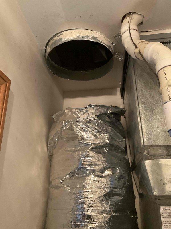 Responded to installation callback for reported ductwork separation above evaporator coil. Upon inspection, found flexible supply duct had disconnected from plenum collar at ceiling penetration. Reconnected and secured flexible ductwork to metal collar using proper strapping, ensuring airtight seal and adequate support to prevent future separation. Verified all mechanical and electrical connections, confirmed system operation, and documented completed installation with photos.