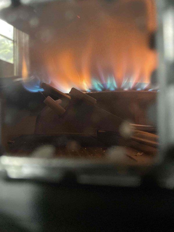 Responded to no-light condition on tanked water heater with standing pilot system. Upon inspection, confirmed pilot would not remain lit, indicating failed thermocouple as suspected. Accessed burner compartment, tested thermocouple output, and verified insufficient millivolt generation to hold gas valve open. Replaced defective thermocouple with new unit, repositioned pilot assembly for proper flame impingement on thermocouple tip, and successfully relit pilot. Verified main burner ignition, proper flame characteristics with blue base and yellow tips, and confirmed unit cycling correctly through thermostat demand. System restored to full operation.