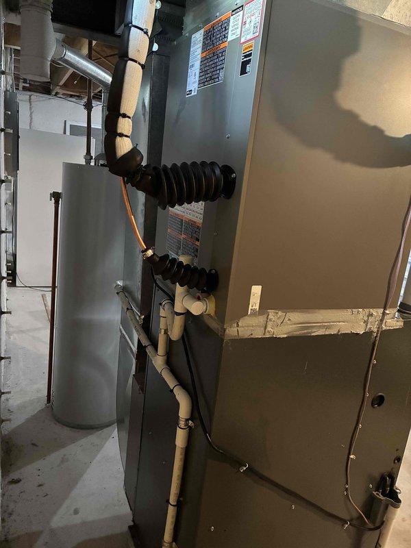 Completed mechanical installation of 3-ton air conditioning system with matching evaporator coil in rear yard location. Installed new indoor air handler unit in basement mechanical room, connected refrigerant lines, established electrical connections, and mounted smart thermostat for system control.