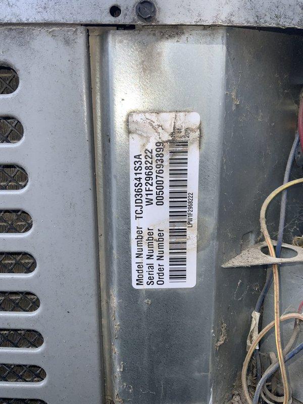 Responded to no cooling complaint on 10+ year old Goodman TCUD6941S3A unit. Upon inspection, found outdoor disconnect box with heavily corroded fuse holders, deteriorated wiring connections, and significant debris accumulation affecting electrical supply to condensing unit. Cleaned disconnect box, replaced corroded fuses, tightened all electrical connections, and verified proper voltage supply to equipment, restoring cooling operation to system.