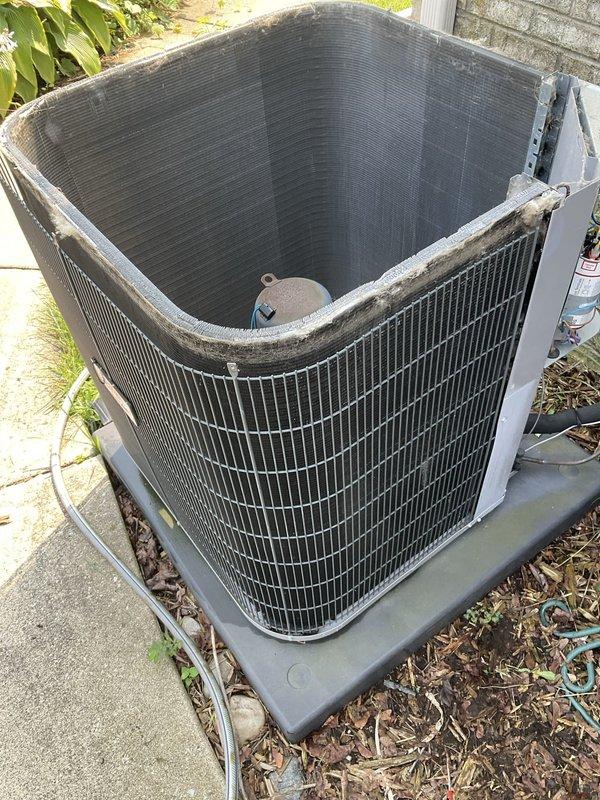 Completed annual preventive maintenance tune-up on a six-year-old residential air conditioning system. Performed comprehensive inspection of outdoor condenser unit, including examination of compressor motor (Part #1185924), condenser coil fins, electrical connections, and refrigerant levels. All components found operating within normal parameters with no deficiencies noted. System tested and confirmed functioning properly with no customer-reported issues.
