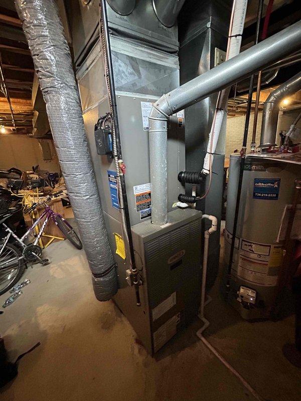 Completed installation of 3.5 ton air conditioning system with matching evaporator coil in rear yard location. Performed all mechanical and electrical connections to integrate new outdoor condensing unit with existing furnace system in basement, reconnected refrigerant lines, and verified proper system operation upon startup.
