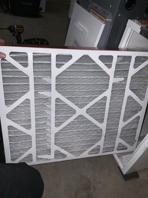 Responded to no cooling complaint on 8-year-old Daikin central air conditioning system. Found indoor air handler blower operational but circulating warm air with no refrigerant cooling. Diagnosed severely restricted airflow due to heavily loaded air filter causing system protection shutdown. Replaced dirty 20x25x5 pleated media filter with new Filtrete filter, restoring proper airflow to evaporator coil. System tested and verified cooling operation restored with adequate airflow and temperature differential across coil.