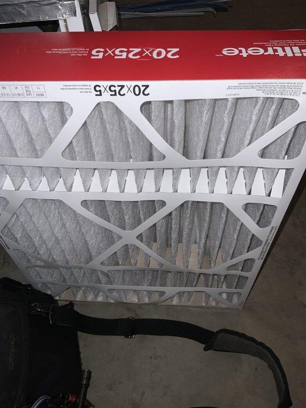 Responded to no cooling complaint on 8-year-old Daikin central air conditioning system. Found indoor air handler blower operational but circulating warm air with no refrigerant cooling. Diagnosed severely restricted airflow due to heavily loaded air filter causing system protection shutdown. Replaced dirty 20x25x5 pleated media filter with new Filtrete filter, restoring proper airflow to evaporator coil. System tested and verified cooling operation restored with adequate airflow and temperature differential across coil.