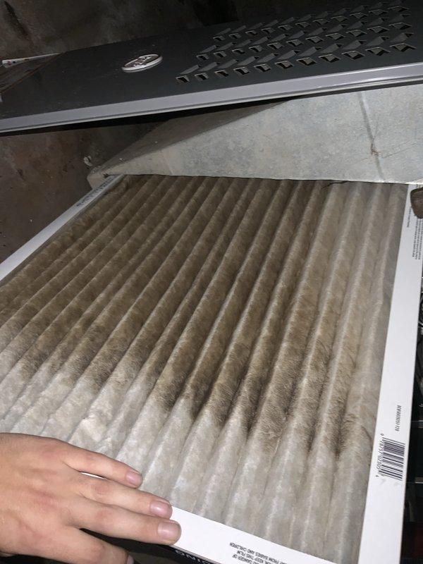 Responded to no cooling call on residential air conditioning system. Upon arrival, unit was unresponsive with no audible operation. Investigation revealed heavily soiled air filter with significant dust and debris accumulation, restricting airflow to the system. Removed and inspected blower assembly, noting dust buildup on blower wheel and housing. Replaced dirty air filter with new filter. Cleaned blower wheel and surrounding components to restore proper airflow. Tested system operation and confirmed unit now running properly with adequate cooling output.