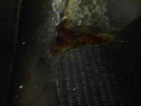 Responded to service call for air conditioning unit leaking approximately one gallon of water onto cement floor during operation. Upon inspection, found evaporator coil showing signs of corrosion and potential drain line obstruction causing condensate overflow. Cleared primary drain line, verified proper condensate flow, and confirmed system cooling functionality remained intact with no electrical hazards present.