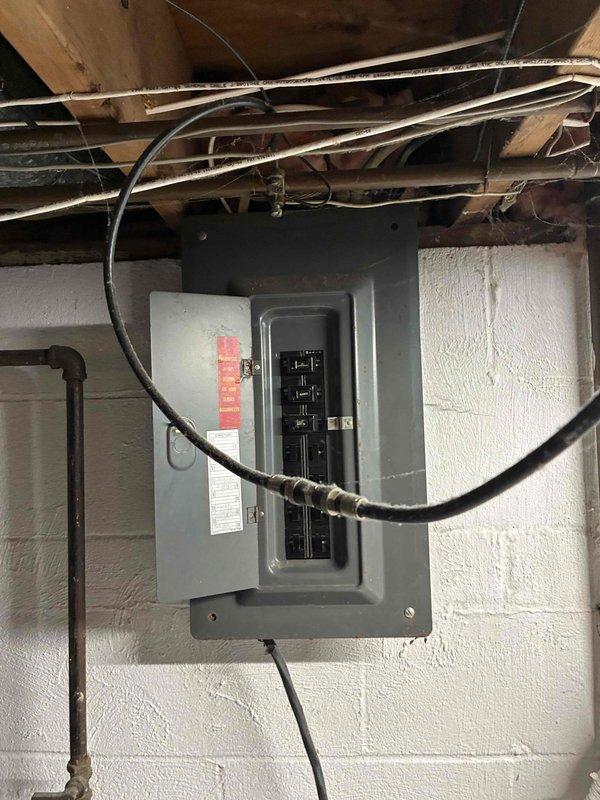 Conducted on-site assessment for HVAC equipment replacement estimate, documenting existing furnace, air conditioning unit, and mini-split systems. Recorded equipment model numbers, serial numbers, and specifications from all components for accurate sizing and replacement recommendations. Photographed electrical service panel and exterior meter installation to evaluate existing electrical capacity and determine if upgrades would be required to support new HVAC equipment installation.
