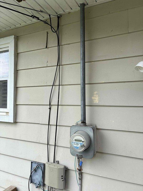 Conducted on-site assessment for HVAC equipment replacement estimate, documenting existing furnace, air conditioning unit, and mini-split systems. Recorded equipment model numbers, serial numbers, and specifications from all components for accurate sizing and replacement recommendations. Photographed electrical service panel and exterior meter installation to evaluate existing electrical capacity and determine if upgrades would be required to support new HVAC equipment installation.