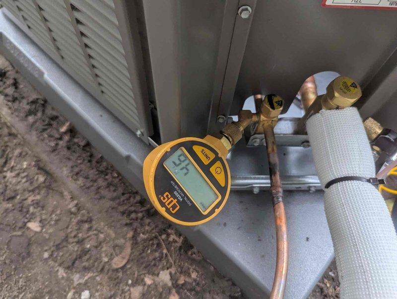 Completed warranty work for crawl space portion of HVAC installation. Performed system diagnostics using digital manifold gauge set, verifying refrigerant pressures at service ports on copper line set with proper brass fittings and insulated suction and liquid lines. Confirmed proper installation of air handler unit in mechanical space with complete condensate drainage system using PVC piping with appropriate primer application at all joints, condensate safety switch properly mounted and secured, and metal ductwork correctly installed with proper support strapping.