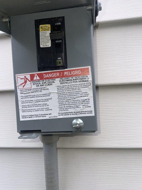 Responded to no cooling complaint on a seven-year-old residential air conditioning system. Upon arrival, verified system was running but delivering room temperature air throughout the home. Inspected outdoor condensing unit, a Goodman model CA13NA024ENGAF8A manufactured in November 2019. Checked electrical disconnect and confirmed power supply to unit. Documented equipment nameplate data including serial number 4819X62435 and electrical specifications showing 208-230 volts AC operation. System appeared to be operating mechanically but not producing cooling as expected, consistent with reported symptoms of failed cooling capacity despite unit running normally.