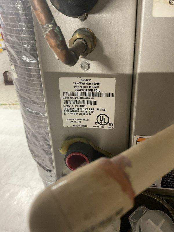 Performed estimate for replacement of 20-year-old residential air conditioning system that is not blowing cold air. Evaluated existing outdoor condensing unit showing signs of age and corrosion, along with indoor evaporator coil manufactured by CAC/BRP. Provided replacement options for complete AC system to restore cooling functionality to the home.