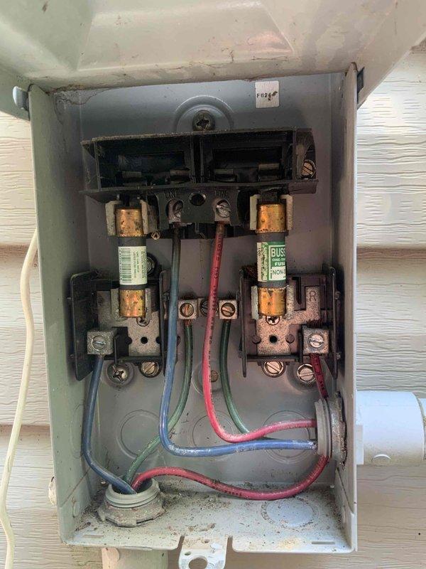 Responded to no cooling call on aging residential air conditioning system. Upon arrival, found DTE had completed electrical service repairs to disconnect box and associated wiring. Verified proper fuse installation, checked all electrical connections at disconnect, and confirmed system power restoration. Unit returned to normal cooling operation following utility company's electrical repairs.