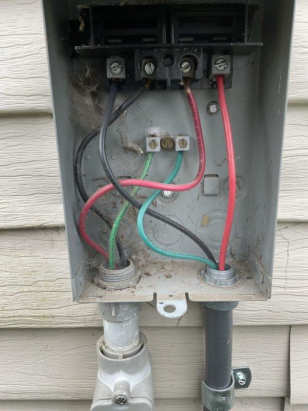 # HVAC Maintenance Visit Summary

Completed prepaid air conditioner tune-up maintenance during requested afternoon time window. Performed comprehensive inspection and maintenance of outdoor condensing unit and associated electrical components.

# Work Performed

Conducted thorough visual inspection of outdoor condensing unit mounted on building exterior. Verified unit levelness using precision level tool to ensure proper refrigerant flow and compressor operation. Confirmed unit was within acceptable tolerances for horizontal positioning, which is critical for optimal performance and equipment longevity.

Inspected electrical service panel and disconnect box mounted on exterior wall near condensing unit. Examined all electrical connections, terminal blocks, and wiring configurations. Verified proper wire terminations including line voltage connections with red, black, green ground, and control wiring. Checked conduit entries and fittings for secure installation and weatherproofing integ
