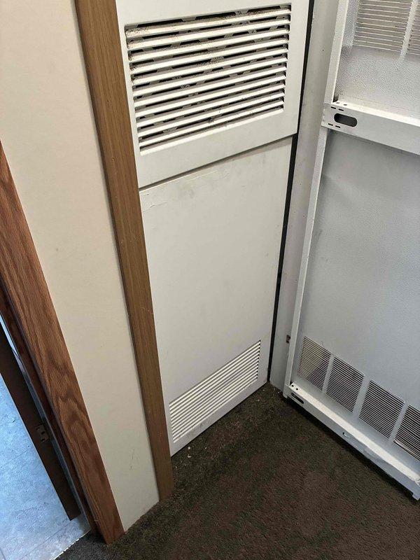 Provided estimate for complete HVAC system replacement including separate furnace and air conditioning unit for residential property. Current system is non-operational and requires full replacement. Equipment is located with outdoor condenser unit positioned on concrete pad adjacent to house foundation, and indoor furnace components accessible through interior space with existing ductwork and ventilation grilles. System utilizes natural gas fuel source for heating operations.