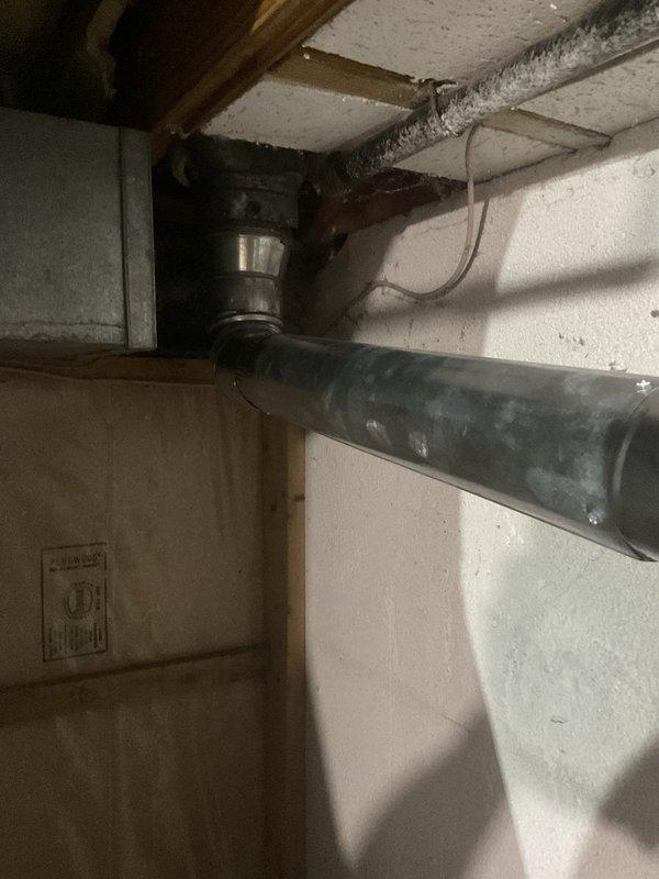Conducted assessment of existing standard water heater installation in residential basement utility area to provide replacement estimate. Evaluated current working unit with natural draft venting configuration, including inspection of copper supply lines, safety valve assembly, and venting ductwork connections. Documented existing equipment specifications, plumbing connections, and clearance requirements for standard water heater replacement proposal.
