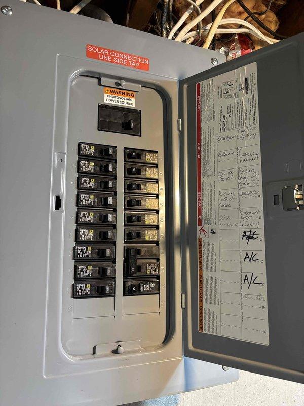 Installed ground fault circuit interrupter (GFI) protection at exterior location near brick wall and chain-link fence boundary. Accessed main electrical panel in attic space, identified appropriate circuit for outdoor receptacle, and configured GFI breaker to provide required ground fault protection for exterior outlet. Verified proper operation of GFI device and confirmed circuit integrity upon completion.