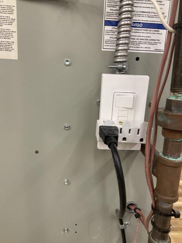 Responded to intermittent AC cutout complaint on one-month-old system under warranty. Upon inspection, found unit wired to standard outlet rather than dedicated circuit as required by manufacturer specifications. Identified GFCI outlet as potential source of nuisance tripping causing intermittent operation. Documented electrical installation with photos showing flex conduit connection and current wiring configuration. Advised that proper electrical circuit installation per manufacturer requirements is necessary to resolve intermittent shutdown issue and maintain warranty compliance.