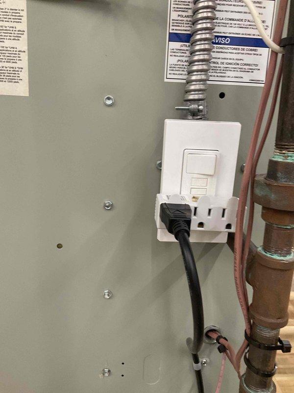 Responded to intermittent AC cutout complaint on one-month-old system under warranty. Upon inspection, found unit wired to standard outlet rather than dedicated circuit as required by manufacturer specifications. Identified GFCI outlet as potential source of nuisance tripping causing intermittent operation. Documented electrical installation with photos showing flex conduit connection and current wiring configuration. Advised that proper electrical circuit installation per manufacturer requirements is necessary to resolve intermittent shutdown issue and maintain warranty compliance.