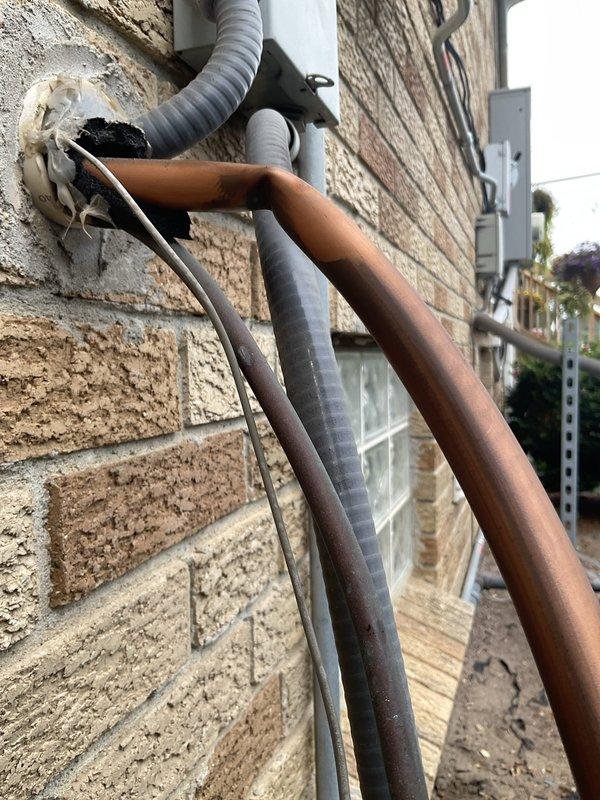 Completed seasonal air conditioning maintenance agreement visit. Inspected exterior refrigerant lines and electrical connections at outdoor unit, verified system amperage readings using clamp meter showing normal operating parameters within manufacturer specifications. All components functioning properly with no issues identified during inspection.