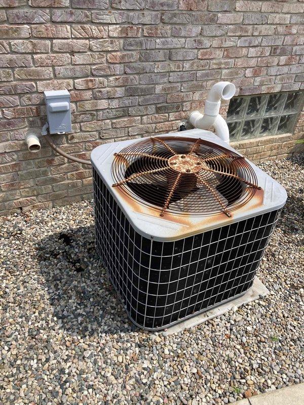 Responded to no cooling complaint on residential air conditioning system over 10 years old. Upon arrival, confirmed condenser unit operating but delivering warm air to living space. Inspected outdoor unit and found compressor not running while fan motor operated normally. Verified blower assembly inside air handler showed significant dust accumulation on squirrel cage wheel affecting airflow efficiency. Diagnosed failed compressor and restricted airflow as primary issues preventing proper cooling. Provided customer with repair options and system replacement recommendations given age of equipment.