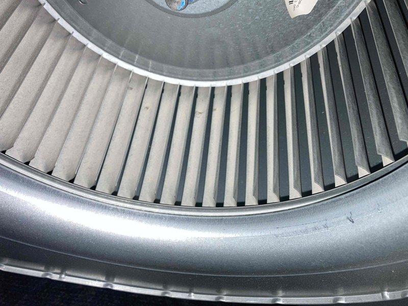 Responded to no cooling complaint on residential air conditioning system over 10 years old. Upon arrival, confirmed condenser unit operating but delivering warm air to living space. Inspected outdoor unit and found compressor not running while fan motor operated normally. Verified blower assembly inside air handler showed significant dust accumulation on squirrel cage wheel affecting airflow efficiency. Diagnosed failed compressor and restricted airflow as primary issues preventing proper cooling. Provided customer with repair options and system replacement recommendations given age of equipment.