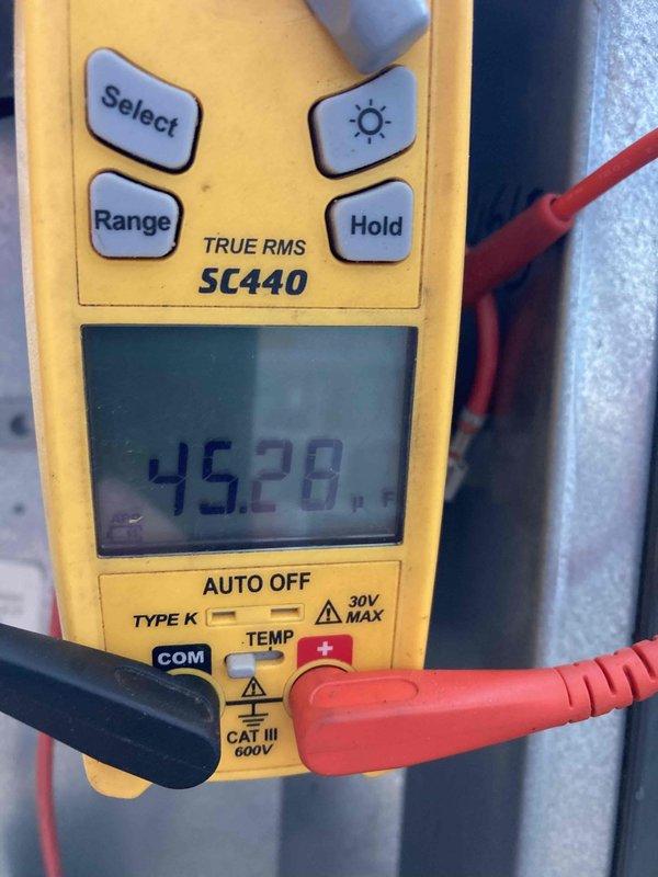 Completed prepaid air conditioner tune-up maintenance during morning appointment window. Performed comprehensive system inspection of outdoor AC unit, including electrical measurements using digital multimeter to verify proper voltage and amperage readings at 45.28 units. Inspected Emerson control board assembly, relay components, and multi-pin wire connections within control panel to ensure proper operation and secure terminations. No issues identified; system operating within normal parameters.