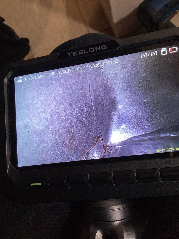 # HVAC Service Report

Responded to no-cool call on 10+ year old system with air handler failure and odor from furnace. Upon inspection, utilized borescope camera to investigate interior components and ductwork for potential blockages, debris, or biological growth that could cause malfunction and odor. Documented unit specifications showing R410A refrigerant system rated for 208-230V AC operation. Performed diagnostic inspection of condenser coil, verified unit serial number 3112E20376, and assessed overall system condition to determine root cause of air handler failure and furnace odor complaint.