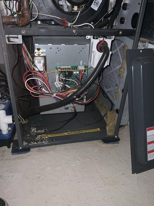 # HVAC Service Completed

Responded to service call for air conditioning system not cooling adequately. Unit confirmed operational but delivering insufficient cooling performance. Performed diagnostic evaluation on International Comfort Products model END4X3NL17A1 air conditioning system, manufactured May 2020, utilizing R-410A refrigerant. 

Conducted thorough inspection of exterior condensing unit and interior air handler components. Accessed control board and electrical connections within furnace cabinet to verify proper system operation and identify potential issues affecting cooling capacity. Documented equipment nameplate data and current system configuration for service records.