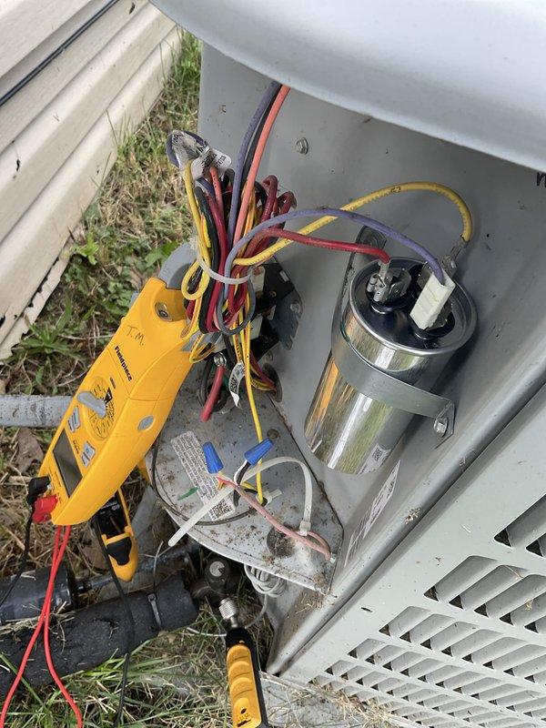 Responded to no-cool call on 9-year-old central air conditioning system. Customer reported outdoor fan operating but unit not producing cool air. Upon arrival, performed diagnostic testing of electrical components at condensing unit. Utilized digital multimeter to test capacitor functionality and verify proper voltage to compressor circuit. Identified failed capacitor preventing compressor operation while allowing condenser fan to run. Replaced defective dual-run capacitor with proper OEM replacement rated for system specifications. Verified proper compressor amperage draw and system startup. Tested unit through complete cooling cycle, confirmed adequate airflow and temperature drop across evaporator coil. System restored to normal operation with proper cooling capacity.