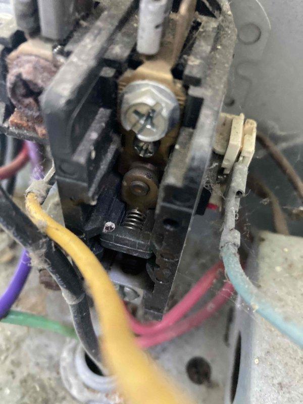 Completed routine preventive maintenance inspection under Club AC8-12 agreement. Inspected electrical terminal connections and wiring, noting normal dust accumulation on terminal block and connected wires consistent with operational equipment. Evaluated and serviced air filtration system, with filter showing typical dirt loading requiring attention during this maintenance visit.